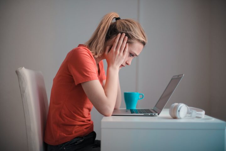 woman in front of computer, woman stressed