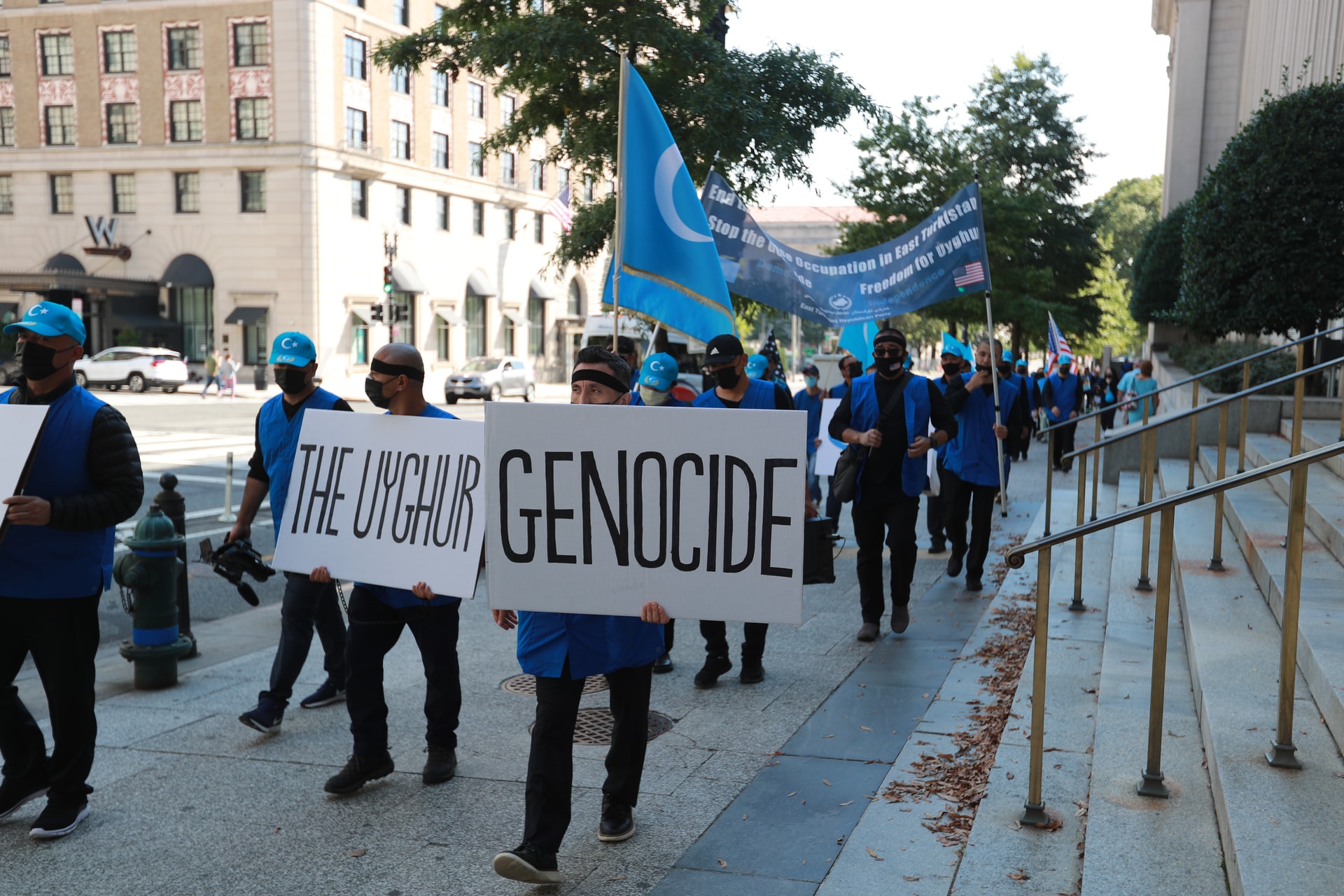 Protesters in Washington, D.C., carry a placard saying "The Uyghur genocide." Uyghurs are targetted by China's transnational repression campaign.