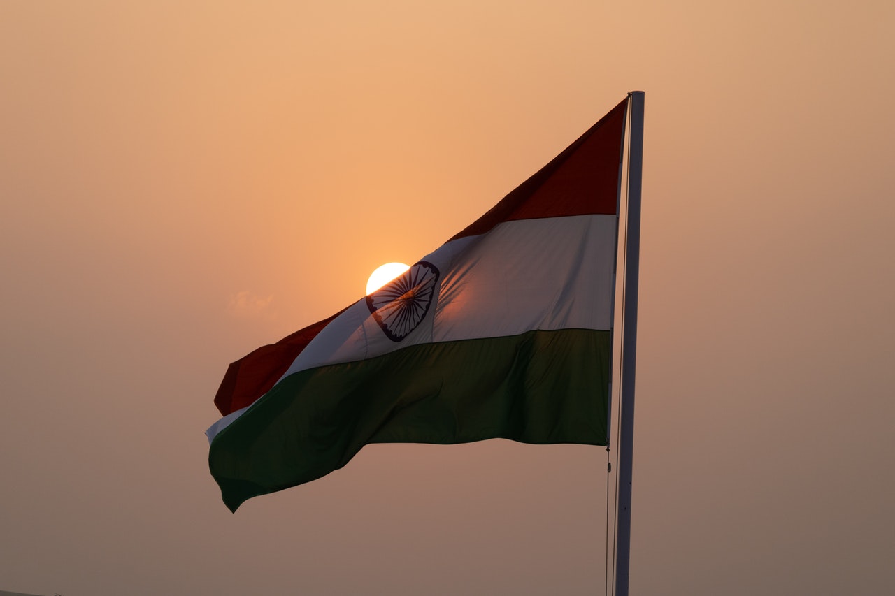 Photo of Indian flag against the sky. Former ambassador describes the pandemic situation in India.