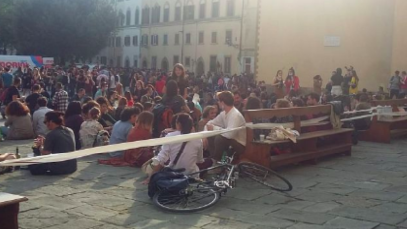 People in a square in Italy.