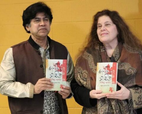 Canadian Bengali, Subrata Kumar Das, and poet Anne Michaels holding Das' book on Canadian literature in Bengali.