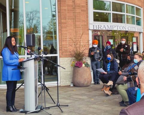 MP Sonia Sidhu speaks in front of Brampton City Hall.