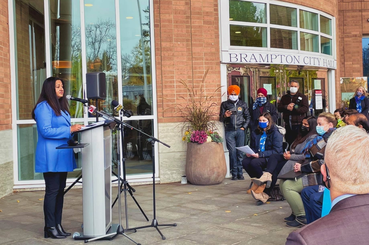 MP Sonia Sidhu speaks in front of Brampton City Hall.