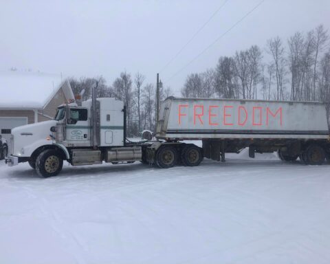 Thousands opposed to vaccine mandates join truckers’ rolling rally to Ottawa as organisers collect more that $3.3 million in donations.