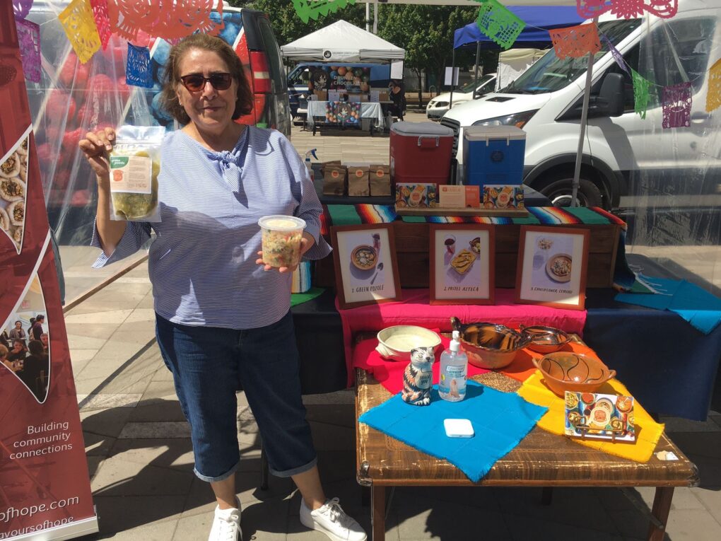 Mis Cazuelas products at a farmers' market