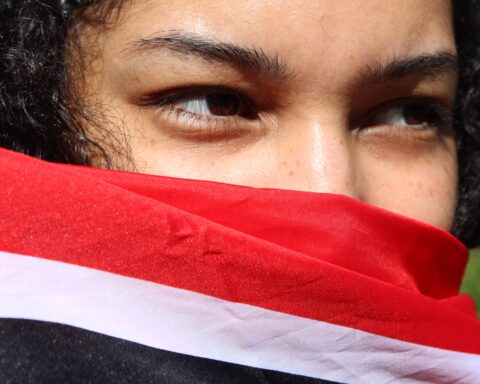 Johanna Venti holding the Trinidad and Tobago flag