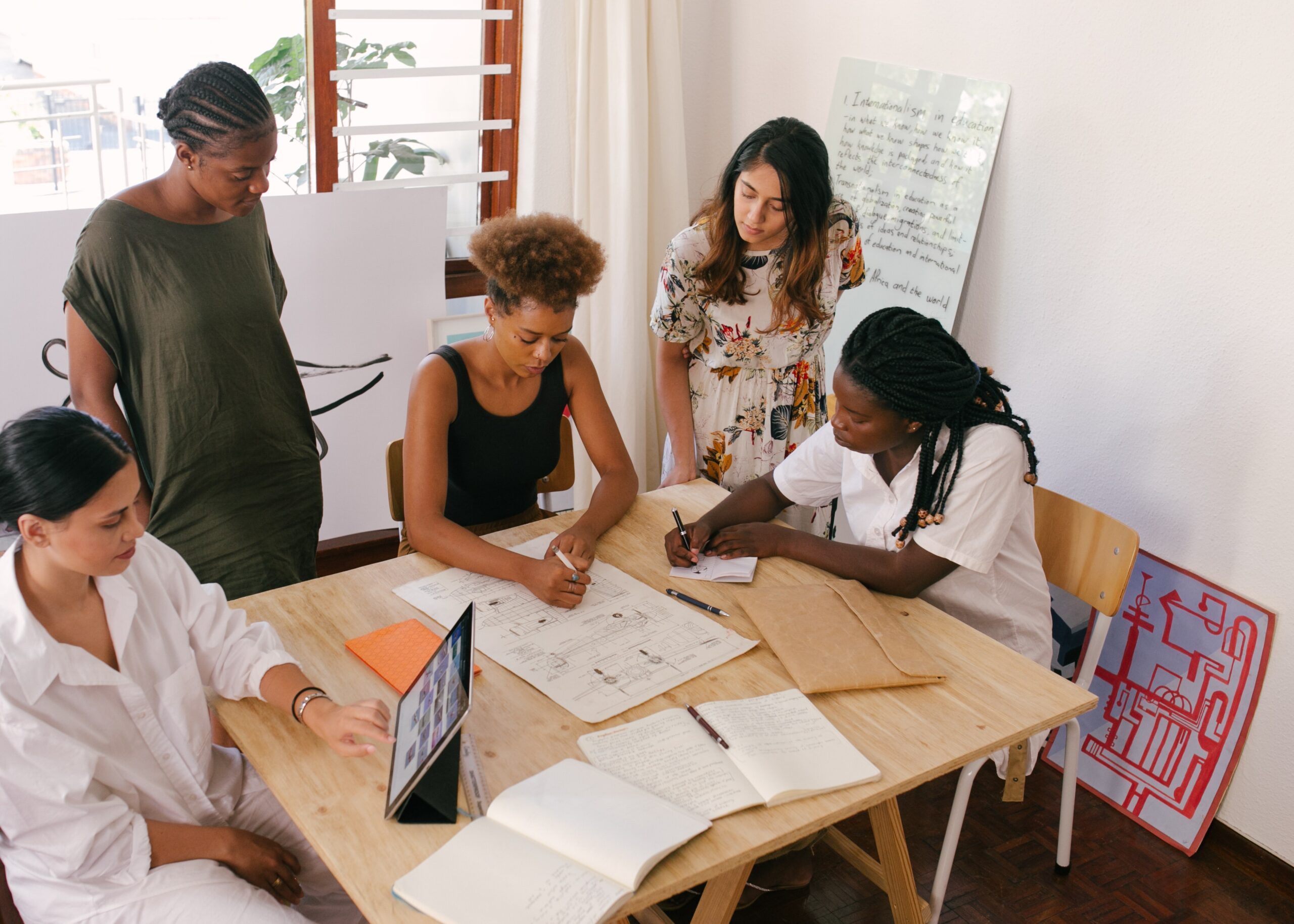 women working together around a table