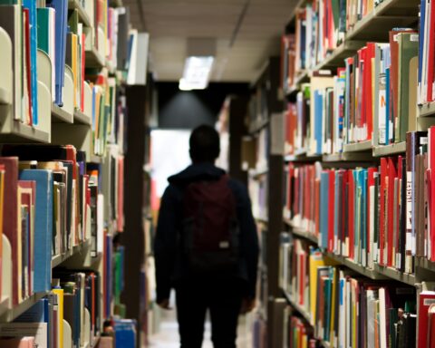 Stock image of a student in a classroom.