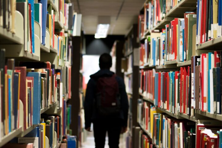 Stock image of a student in a classroom.