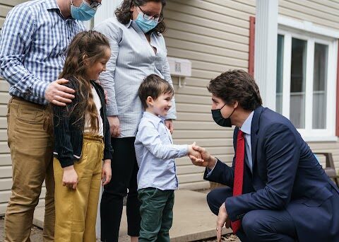 PM Justin Trudeau speaks with families about affordable housing during a visit to Laval