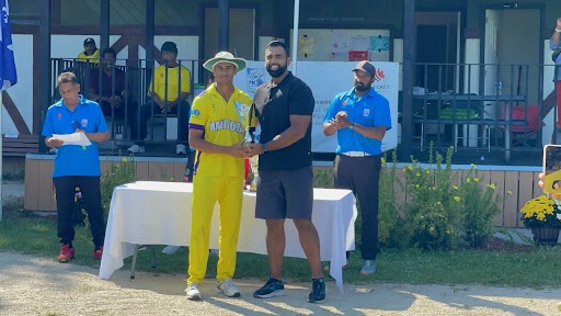 cricket player Gurshaan Dhaliwal being presented with awards