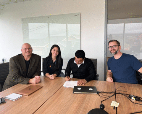 Himanshu Barthwal signs the incubator agreement at Genesis, Newfoundland’s innovation hub in Toronto.