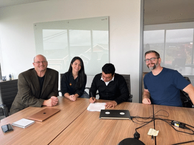 Himanshu Barthwal signs the incubator agreement at Genesis, Newfoundland’s innovation hub in Toronto.