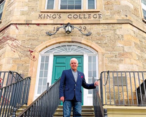 University of New Brunswick economics professor Constantine Passaris says teaching is something he enjoys doing and is the reason why he is still doing it after 50 years on the job. He is shown at the historic Old Arts Building on the UNB campus. (Photo by: Michael Staples/New Canadian Media - Michael Staples/New Canadian Media)