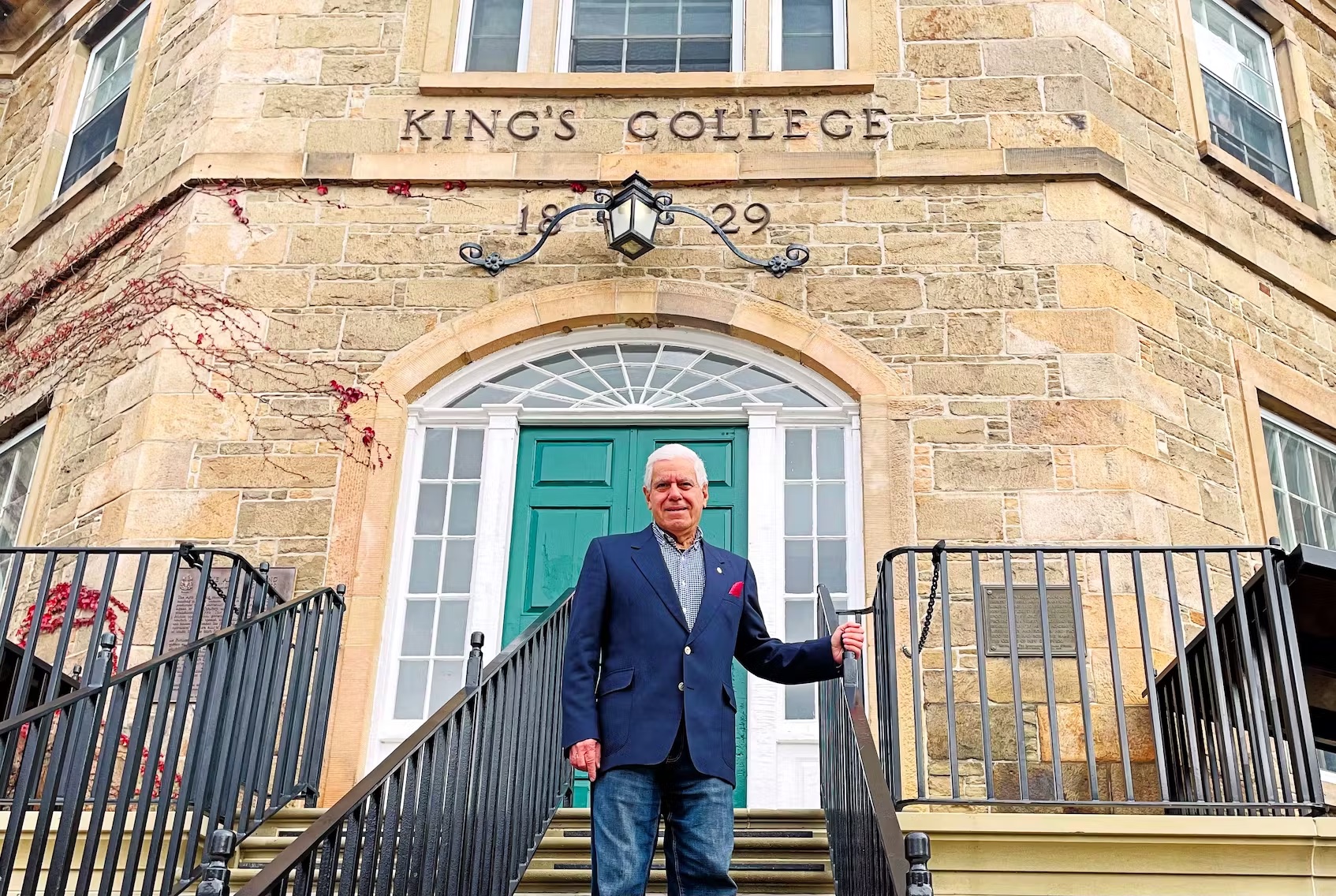 University of New Brunswick economics professor Constantine Passaris says teaching is something he enjoys doing and is the reason why he is still doing it after 50 years on the job. He is shown at the historic Old Arts Building on the UNB campus. (Photo by: Michael Staples/New Canadian Media - Michael Staples/New Canadian Media)