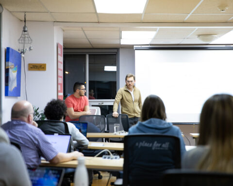 Jan Mertlik and Sahand Seifi (left) are the current leaders of Get Coding, a school that is transforming education and helping build up Newfoundland and Labrador’s tech workforce. Here, they are leading one of Get Coding’s classes.