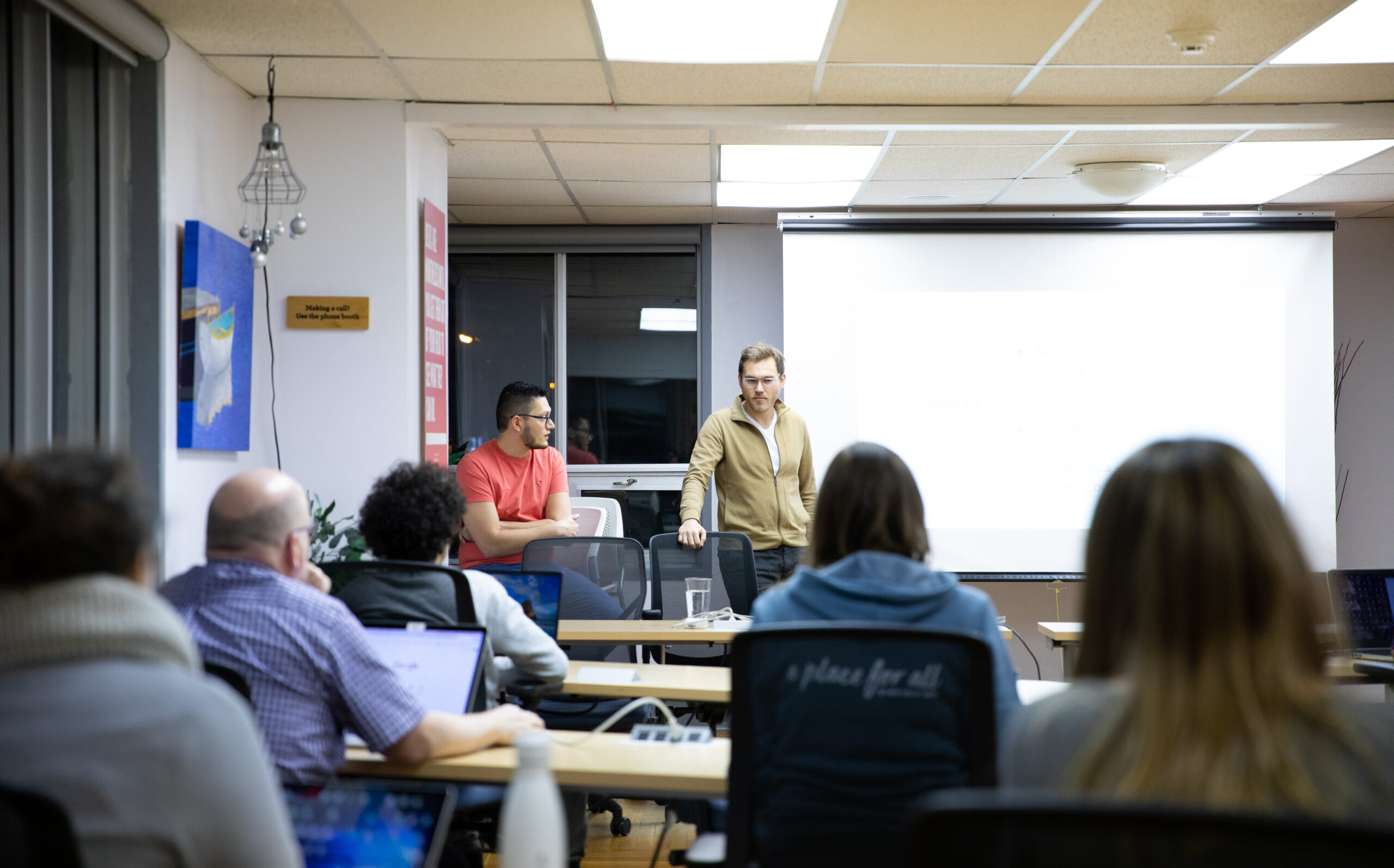 Jan Mertlik and Sahand Seifi (left) are the current leaders of Get Coding, a school that is transforming education and helping build up Newfoundland and Labrador’s tech workforce. Here, they are leading one of Get Coding’s classes.