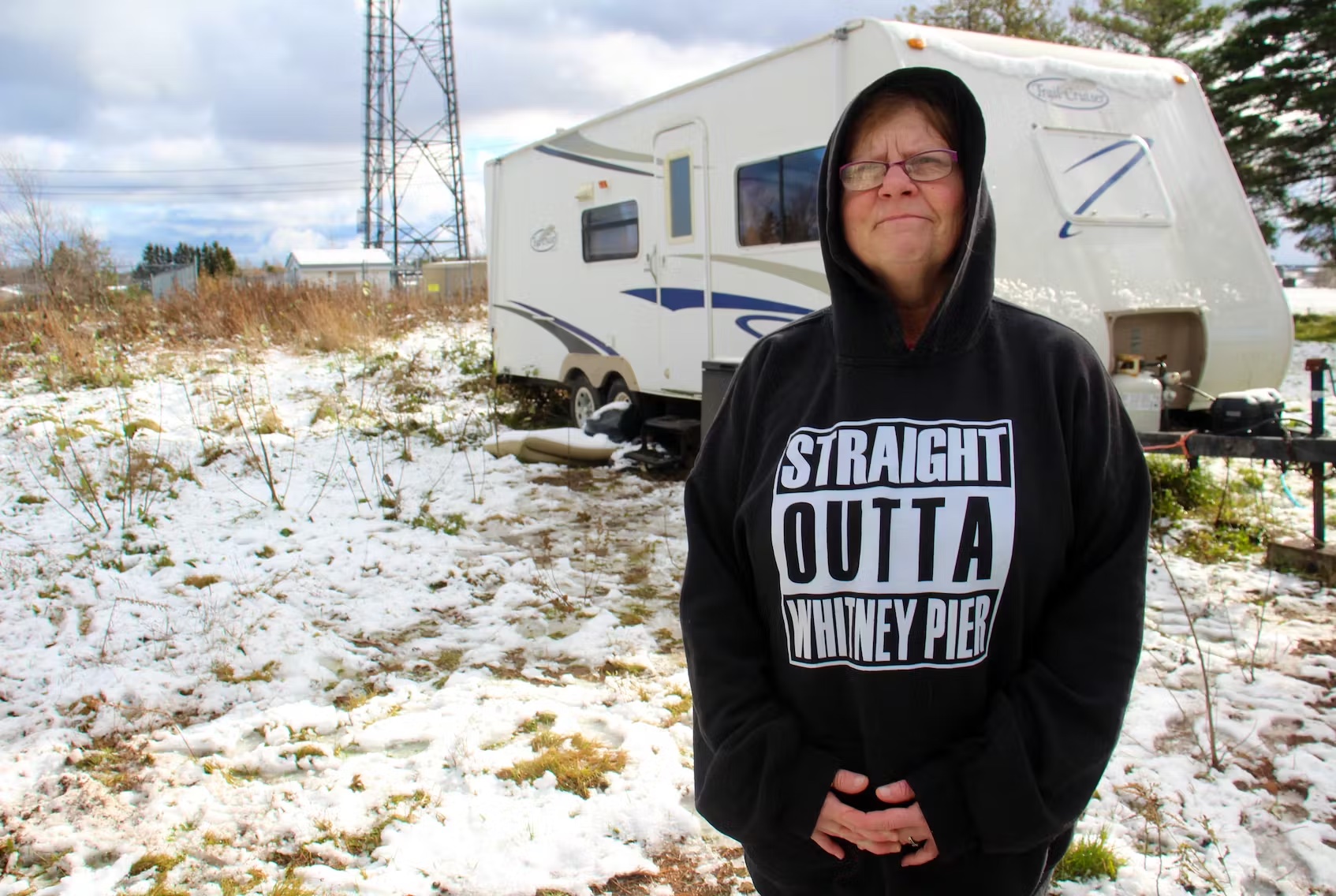 Shannon Dornadic stands outside the recreational vehicle she moved into in August, unable to find affordable housing appropriate to her needs. (Nicole Sullivan / Cape Breton Post)